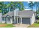 Charming home featuring new siding, garage and driveway at 6304 Marbut Farms Ln, Lithonia, GA 30058
