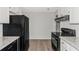 Modern kitchen featuring stainless steel appliances and granite countertops at 6304 Marbut Farms Ln, Lithonia, GA 30058