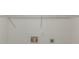 Bright laundry room with white walls, shelf and utility connections at 6304 Marbut Farms Ln, Lithonia, GA 30058