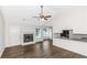 Inviting living space with a fireplace, new flooring, and plenty of natural light at 6304 Marbut Farms Ln, Lithonia, GA 30058