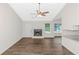 Open living area showcasing a fireplace and seamless flow with new flooring at 6304 Marbut Farms Ln, Lithonia, GA 30058