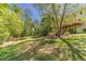 Sprawling backyard with lush green lawn and mature trees creating a private oasis at 776 Myerston Ct, Lawrenceville, GA 30044
