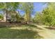 Lush green backyard featuring mature trees and well maintained lawn at 776 Myerston Ct, Lawrenceville, GA 30044
