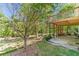 A lovely backyard with a deck overlooking serene, wooded landscaping at 776 Myerston Ct, Lawrenceville, GA 30044