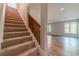 Finished basement with carpeted stairs, wood flooring, and natural light from the two windows at 776 Myerston Ct, Lawrenceville, GA 30044