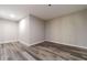 Spacious unfinished room with wood floors, neutral walls, and ample space for customization at 776 Myerston Ct, Lawrenceville, GA 30044