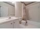 Bathroom featuring a shower-tub combo and white vanity with tile flooring at 776 Myerston Ct, Lawrenceville, GA 30044