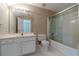 Updated bathroom with sink, vanity, toilet and glass enclosed tub and shower at 776 Myerston Ct, Lawrenceville, GA 30044