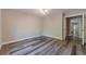An inviting bedroom with gray wood flooring and a neutral color palette at 776 Myerston Ct, Lawrenceville, GA 30044