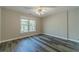 Bright bedroom with a large window, neutral paint, and wood flooring for a serene retreat at 776 Myerston Ct, Lawrenceville, GA 30044