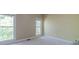 A cozy bedroom with natural light and neutral carpet at 776 Myerston Ct, Lawrenceville, GA 30044