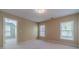 A bedroom with neutral colors, carpet, a walk-in closet, and natural light at 776 Myerston Ct, Lawrenceville, GA 30044