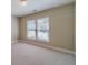 Bedroom featuring carpet, window, and neutral walls at 776 Myerston Ct, Lawrenceville, GA 30044