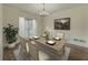 Formal dining room with hardwood floors, decorative trim, and a window providing natural light at 776 Myerston Ct, Lawrenceville, GA 30044
