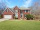 Charming two-story brick home with manicured lawn and attached two-car garage at 776 Myerston Ct, Lawrenceville, GA 30044