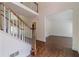 Open foyer with hardwood floors, staircase, and views into adjacent living spaces at 776 Myerston Ct, Lawrenceville, GA 30044