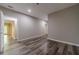 Well lit hall with wood floors and neutral walls leads to other rooms at 776 Myerston Ct, Lawrenceville, GA 30044