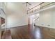 Spacious living room featuring a fireplace, hardwood floors, and stairs leading to the second floor at 776 Myerston Ct, Lawrenceville, GA 30044