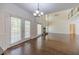 Open-concept space with a living area with high ceilings flowing into dining area with a view of the outdoor deck at 776 Myerston Ct, Lawrenceville, GA 30044