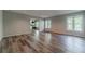 Open-concept living room with abundant natural light and views of kitchen at 776 Myerston Ct, Lawrenceville, GA 30044