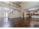 Spacious living room featuring a staircase, hardwood floors, and an open layout that connects to the kitchen at 776 Myerston Ct, Lawrenceville, GA 30044