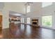 Large living room with a fireplace and an open layout that connects to the kitchen and outdoor deck at 776 Myerston Ct, Lawrenceville, GA 30044