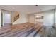 Open-concept living room with hardwood floors, stairs, and views into the kitchen for easy entertaining at 776 Myerston Ct, Lawrenceville, GA 30044