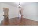 Open living room with hardwood floors, decorative trim, and views into other rooms at 776 Myerston Ct, Lawrenceville, GA 30044