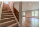 A view of a cozy staircase with wood railing and carpet runner at 776 Myerston Ct, Lawrenceville, GA 30044