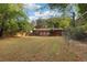 Back of house showing brickwork, windows, and fenced backyard at 2081 Beecher Sw Rd, Atlanta, GA 30311
