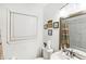 Bright bathroom with a modern vanity, neutral decor, and a window for natural light at 2081 Beecher Sw Rd, Atlanta, GA 30311