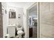 Clean bathroom featuring a tiled shower, modern vanity, and neutral decor at 2081 Beecher Sw Rd, Atlanta, GA 30311