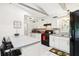Bright and modern kitchen featuring white cabinets, stainless steel appliances, and a stylish breakfast bar at 2081 Beecher Sw Rd, Atlanta, GA 30311