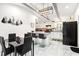 Modern kitchen featuring white cabinets, a center island, and stylish lighting at 2081 Beecher Sw Rd, Atlanta, GA 30311