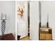 Small, bright laundry room with wooden shelf space, and a full size washing machine at 2081 Beecher Sw Rd, Atlanta, GA 30311