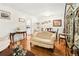 Cozy living room featuring hardwood floors, an elegant sofa, and a dining area at 2081 Beecher Sw Rd, Atlanta, GA 30311