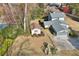 Aerial view of a house showcasing mature trees, backyard with pool, and an oversized garage at 4036 Winding Valley Se Dr, Smyrna, GA 30082