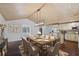 Bright dining area featuring wood floors, modern lighting, and an island with barstool seating at 4036 Winding Valley Se Dr, Smyrna, GA 30082