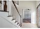 Bright foyer with travertine flooring, stained glass entry, and a view to living area at 4036 Winding Valley Se Dr, Smyrna, GA 30082