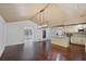 Open-concept kitchen with stainless steel appliances, a center island, hardwood floors, and breakfast area at 4036 Winding Valley Se Dr, Smyrna, GA 30082