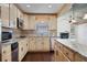 Well-equipped kitchen with granite countertops, tile backsplash, stainless appliances, and a breakfast bar at 4036 Winding Valley Se Dr, Smyrna, GA 30082