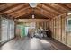 Spacious outbuilding interior featuring laminate floors, ample storage, and bright lighting at 4036 Winding Valley Se Dr, Smyrna, GA 30082