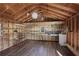 Interior of outbuilding with workbench, shelves and wood floors, perfect for a workshop or studio at 4036 Winding Valley Se Dr, Smyrna, GA 30082