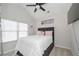 Cozy bedroom with plush carpet, vaulted ceilings, and natural light from the window at 413 Branch Ln, Temple, GA 30179