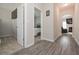 Hallway with view into a cozy bedroom and a living room with a fireplace at 413 Branch Ln, Temple, GA 30179