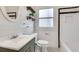 Stylish bathroom featuring a tiled floor, vanity, subway tile backsplash, and shower at 934 Hope Dr, Atlanta, GA 30310