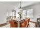 Open dining room boasts bright windows and opens to living room and kitchen at 934 Hope Dr, Atlanta, GA 30310