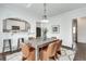 Dining room with stylish seating, open to kitchen bar, and featuring a modern light fixture at 934 Hope Dr, Atlanta, GA 30310