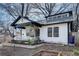 Renovated bungalow featuring black trim, white siding and a front porch at 934 Hope Dr, Atlanta, GA 30310
