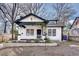 Charming renovated bungalow with black trim, white siding and front porch at 934 Hope Dr, Atlanta, GA 30310